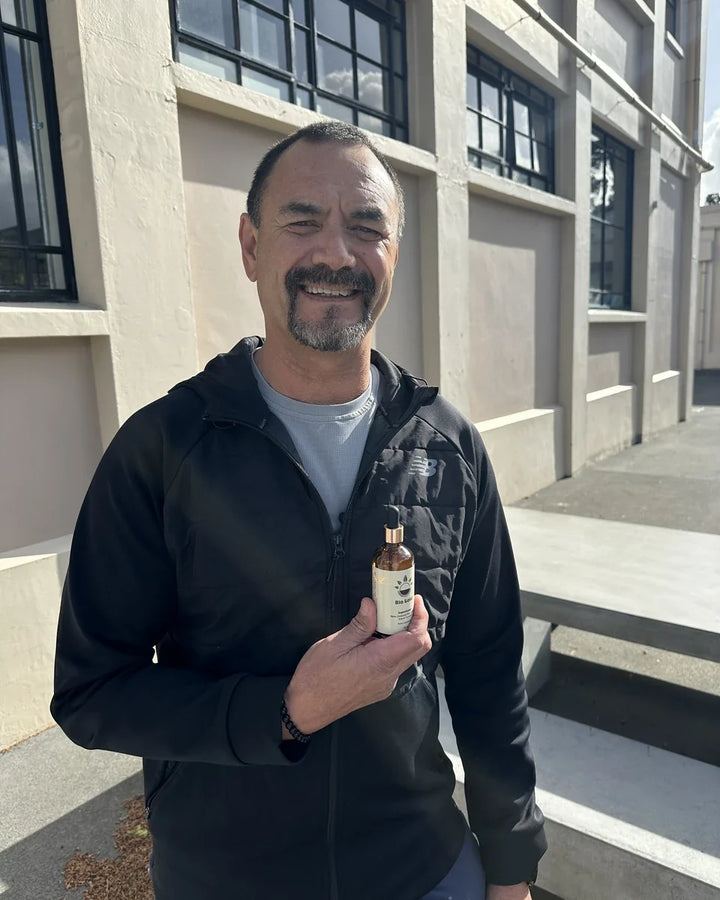 John holding a bottle of Pine Pollen Supercharge®